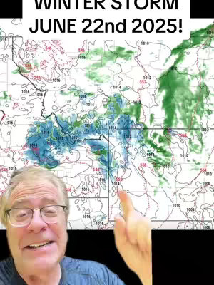 A man with glasses and a blue shirt smiles and points towards a weather map graphic, with text that reads "WINTER STORM JUNE 22nd 2025!". The map displays weather patterns, including areas of green and blue.