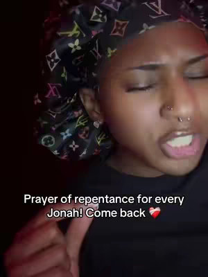 Close-up shot of a Black woman with her eyes closed, wearing a dark patterned bonnet. Her expression suggests emotion, with a slight opening of her mouth. Text overlay is added to the bottom informing the viewer of the video's content.
