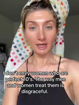 A woman with fair skin, light eyes, and blonde hair is the central focus. She wears a black spaghetti-strap top and has a towel wrapped around her head. Text is overlaid on the image.