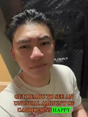 A selfie-style shot of a man with a neutral expression against a blurred background, text overlays are visible.
