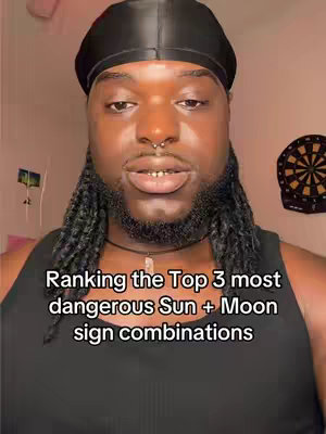 The cover image features a close-up of a black man, wearing a black durag, and a black tank top. His facial features take up a significant portion of the frame. Additional background elements are visible which include a dart board. Text overlay at the bottom of the frame reads Ranking the Top 3 most dangerous Sun + Moon sign combinations.