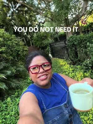 A selfie-style shot with a woman holding a cup outside. The background is lush greenery including trees and a fence, with the text overlayed.