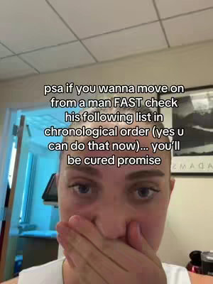 A selfie-style shot features a person covering their mouth with their hand, focusing on their face. Overlaid text in white details advice on moving on from a relationship issue.
