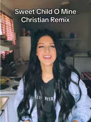 A woman with long black hair is smiling at the camera with the text overlayed on top. Behind her is a kitchen setting.