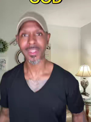 The cover image features a man with a gray cap and a black v-neck shirt, looking directly at the camera and speaking. The background is a softly lit living room with neutral-toned walls.
