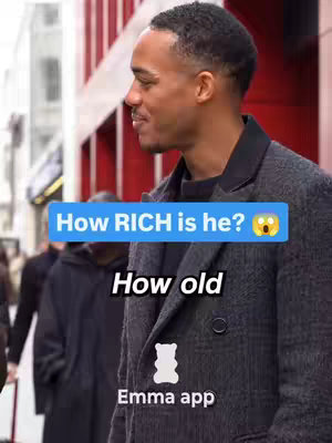A man in a grey overcoat is set against an urban background. The image has text overlay on the image.