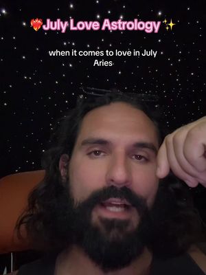 A man with a dark beard and long dark hair is centered in the frame, looking towards the camera. Above him is text that has pink and yellow elements. The background is a starry night design.