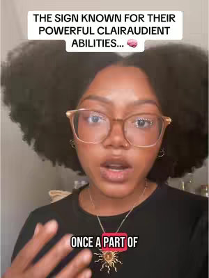 A woman with dark, curly hair and glasses speaks directly to the camera. Text overlays appear at the top and bottom of the frame.