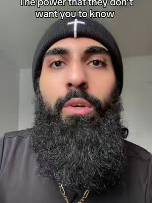 A close-up shot of a man with a beard and a black beanie. Text overlay at the top reads 'The power that they don't want you to know.'