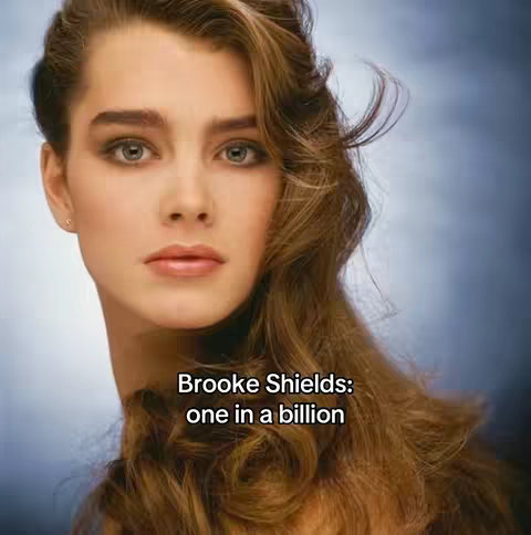 The cover image features a portrait of actress Brooke Shields. She's positioned centrally, with a soft blue and white gradient backdrop. Her hair is styled with volume, waves framing her face. Text overlay is applied with the statement 'Brooke Shields: one in a billion' on the screen.
