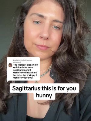 A woman with brown hair and blue eyes looks at the camera. A white speech bubble with black text is in the top left corner, and text at the bottom says, 'Sagittarius this is for you hunny' in white letters. 