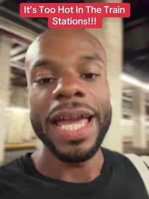 The cover image shows a close-up of a Black man's face, with text overlayed. He has a bald head, a short beard, and is wearing a black shirt. The background is a blurred train station environment.