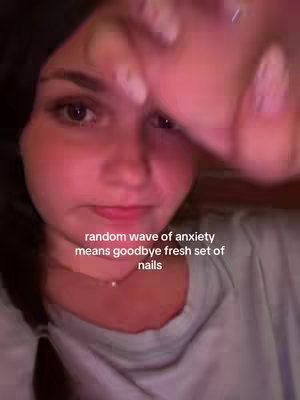The cover image is a selfie-style shot, with the creator's face in the center, slightly angled from the left. The lighting is warm, with a red hue. The creator is looking at the camera and appears to be holding or gesturing with their right hand, partially obscuring the upper right of the frame. Text overlay is added at the bottom of the frame and over the background.