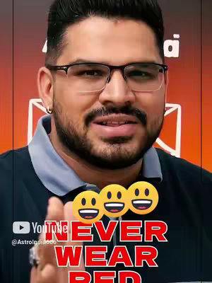 A man with glasses and a beard faces the camera. Text overlays read "NEVER WEAR RED" in white, outlined in red. The background is a gradient of orange and red. There are smiling emojis above the text.