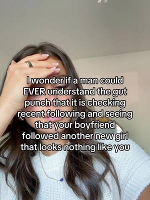 A woman with long brown hair stands in front of a light-colored wall, with text overlayed. She has a ring on her finger and her hand is up to her forehead, covering her hair slightly. The text overlay reveals a statement about relationship problems.