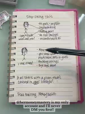 A pink notebook with handwritten plans is displayed on a light-colored surface, possibly a desk. The notebook's pages are filled with black ink, outlining a budget plan with the title "Stop Doing This" at the top and lists of financial behaviors and their consequences, illustrated with simple stick figure drawings and arrows. A pen is present, visually connecting different parts of the diagram. The page has pink borders. The setting looks clean
