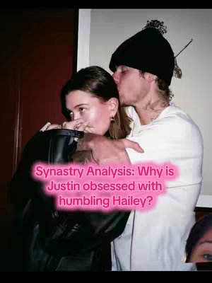 A couple is embracing in a warm, indoor setting. The woman is viewed from the side, resting her head on her partner, who is kissing her temple. Text overlay in a pink gradient at the bottom of the image.