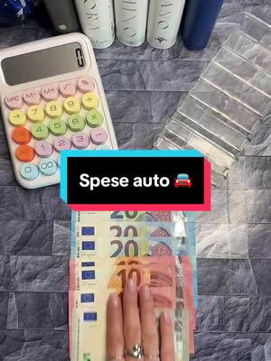 A person's hands are shown holding a wad of Euros, while a calculator, clear organizing compartments, and cosmetic bottles are in the background. The image centers on the cash notes with a text overlay.