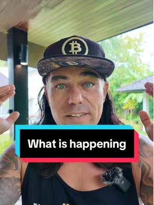 A man with long hair, a black hat with a Bitcoin logo, is centered. The background shows a green outdoor setting. In the foreground is a rectangular box-shaped text overlay with red and blue colors.