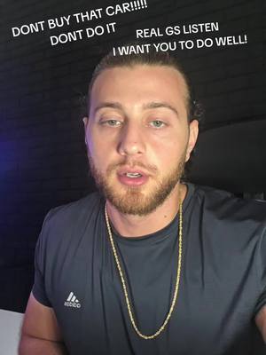A selfie-style video cover. A young man with a beard and a gold chain is centered in the frame against a dark background. White text overlays are above his head.