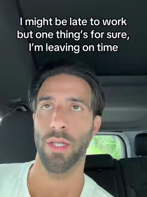 A man is seated in a car, looking up with a contemplative expression. Text overlayed above him reads, “I might be late to work but one thing’s for sure, I’m leaving on time”. The background shows a glimpse of a green, outdoor setting.