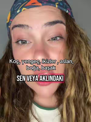 A close-up selfie features a woman with long, wavy brown hair and a patterned headband. She has visible makeup, and the image is well-lit with a soft background. Text overlays are present.