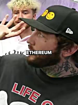 A man holding a phone. The background is out of focus. The text overlay "ETHEREUM" in blocky white text.