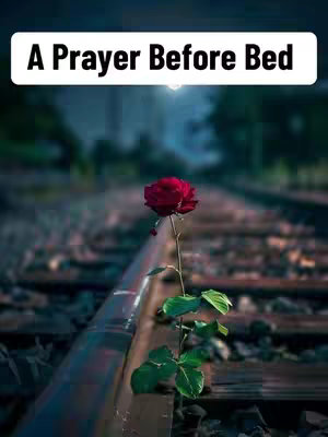 The cover image features a single red rose blooming amidst a weathered railway track. Above, a white banner reads 'A Prayer Before Bed'. The background is blurred, creating a depth of field that highlights the rose and the tracks.