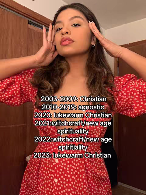 A young woman in a red dress with a white polka dot pattern is the central focus. She poses with her hands near her face, as if cupping her cheeks. Text overlays detail her religious journey over time.