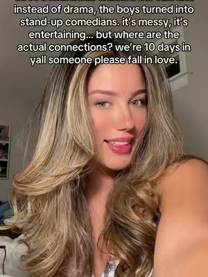 A selfie-style shot features a woman with long, wavy, layered blonde and brown hair, looking towards the camera with a slight smile and her tongue touching her lower lip. The background is blurred, with hints of a room visible. Overlaid text explains the show's current season.