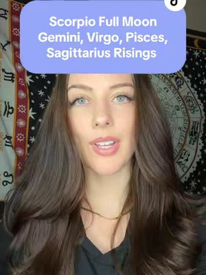 A woman with long brown hair and fair skin is looking directly at the camera. She has a soft smile and is wearing a dark colored top. Above her head is a light blue oval with white text describing the video's content - Scorpio Full Moon, Gemini, Virgo, Pisces, Sagittarius Risings.