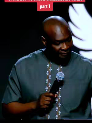 The cover image features a dark-skinned man giving a speech, holding a microphone, on a stage. The lighting focuses on the man, highlighting his face and upper body. The background is dark with light flares appearing on the right of the frame. Text at the top in a red box reads "STRATEGY TO SOLVE CHALLENGING TIMES" and below "part 1"