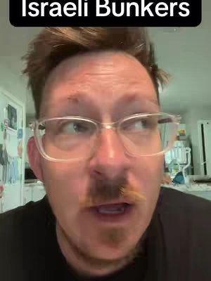 A man with short brown hair, glasses, and a mustache is looking off to the side with a slight expression of surprise or interest. Above him is a dark banner containing white text.