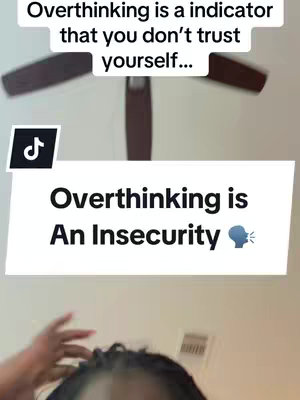 The image is a vertical shot, featuring a ceiling fan and a person's hair and hand in the foreground. Overlaid text in a white box states, "Overthinking is An Insecurity." Above it, "Overthinking is a indicator that you don't trust yourself..." is in the image. There is a Tik Tok logo in the corner. Colors are muted.
