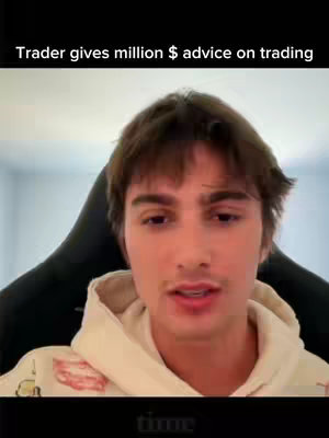 A young man with brown hair is centered in the frame from the chest up, with a hoodie. The background is filled by a black chair with a blurred, out-of-focus setting