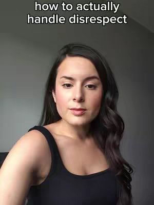 The cover image shows a woman in a close-up shot, slightly angled towards us. She has dark, wavy hair and is wearing a black tank top. The background appears to be a plain, light gray wall. Above her head, white text reads, 'how to actually handle disrespect'. She has a neutral expression.