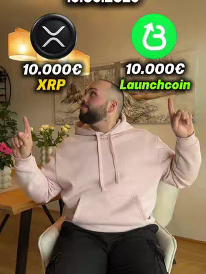 A medium shot presents a man indoors, seated and looking upwards, pointing with both index fingers. He's wearing a light pink hoodie over a black shirt, paired with black cargo pants. Behind him is a wall with a framed artwork. In the upper center are two cryptocurrency logos: Ripple (XRP) and Launchcoin, surrounded by text indicating monetary values.