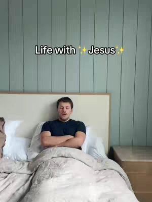 The cover image features a man sitting in bed with his arms crossed. He is positioned against a headboard, with white pillows behind him and a light-colored comforter covering him. The background consists of a light green wall with vertical paneling. To the right of the bed is a light-colored nightstand. The overall composition is simple and clean, with a focus on the man in the bed.