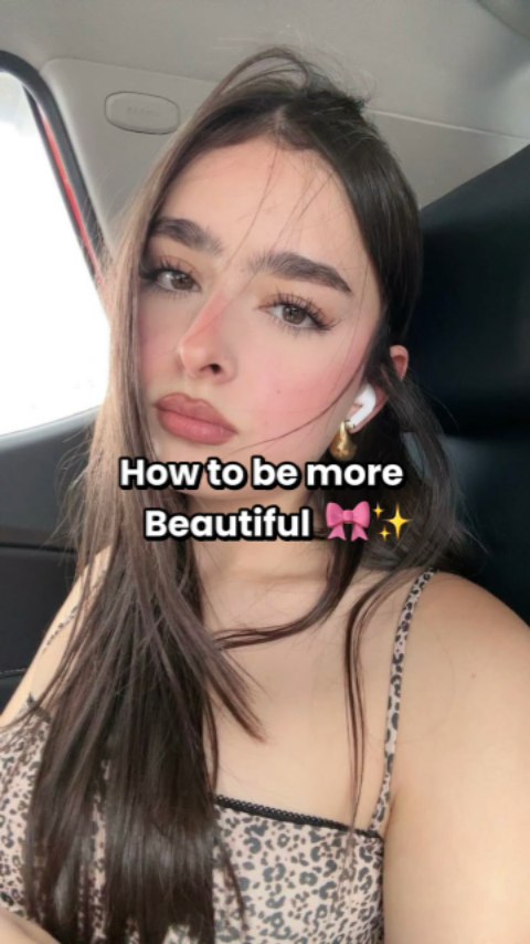 The cover image is a selfie featuring a young woman inside a car. She has long, dark hair and is looking at the camera. She is wearing a leopard print top and white earbuds. The background shows the car's interior. A text overlay is superimposed on the image.