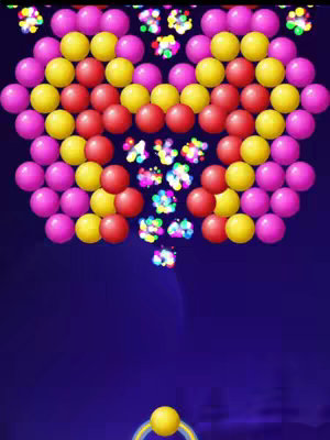 The cover image showcases a vibrant, arcade-style game scene set against a deep blue background. At the top, a collection of colorful bubbles forms a pattern dominated by pink, yellow, and red spheres. These bubbles are arranged in a design reminiscent of a heart shape, with some bubbles seemingly bursting, indicated by smaller, multicolored fragments dispersing downwards. Below, a single yellow bubble resides at the bottom, accompanied by an aiming mechanism. The overall composition suggests a bubble-shooting game, inviting play with immediate visual appeal.