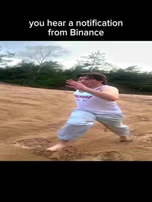 The image shows a man running barefoot on a sandy beach. A text overlay at the top reads, 'you hear a notification from Binance'.
