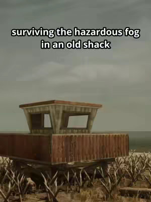 The image shows a rough-looking structure, possibly a shack or a base, set in a desolate, muted environment. The structure's main color is brown, with a square upper level and a lower, rectangular section. The background appears to be a flat, overcast sky in shades of grey. The ground has dry, sparse vegetation. The overall effect is stark and post-apocalyptic.