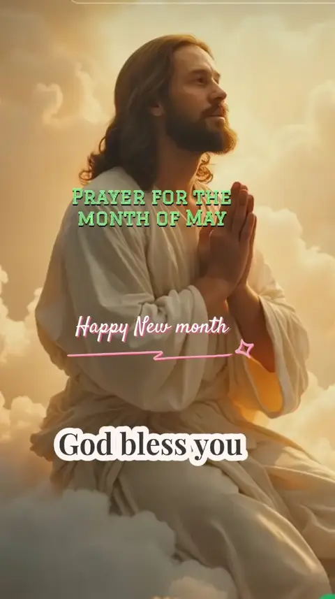 The image features a digitally created depiction of a light-skinned Jesus-like figure. This individual is shown with long, flowing brown hair and a neatly trimmed beard. They are dressed in a white robe and are positioned in prayer, with hands clasped. The background consists of a sky, light, and fluffy clouds, suggesting a heavenly setting. Overlay text at the center reads "PRAYER FOR THE MONTH OF MAY" and "God bless you" at the top and bottom of the image.