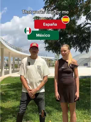A cover image featuring a man and a woman standing in an outdoor setting. Above them are two rectangular text overlays: one red with the Spanish flag and the text 'España,' and the other green with the Mexican flag and the text 'México.' A line of text 'That works fine for me' is also visible at the top of the image.