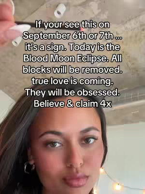 A selfie-style image featuring a young woman with dark hair and hoop earrings. The background is a neutral color. Text is overlaid on the image in a sans-serif font, providing a horoscope.
