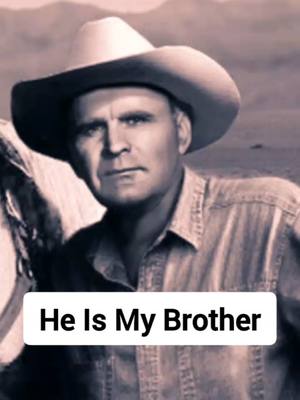 A sepia-toned image features a man wearing a cowboy hat, set against a blurred mountain backdrop. He gazes directly at the viewer, his expression serious. A white rectangular text box at the bottom reads "He Is My Brother." The image is likely promoting a video related to the man or the phrase.