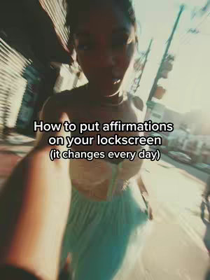 The cover image appears to be a selfie-style shot with the camera angled upwards, slightly blurred. A woman is in focus, with her torso and face prominently visible. She is wearing a top and a skirt. The background is somewhat out of focus, with hints of greenery and a building suggesting an outdoor setting. White text is overlaid on the image.