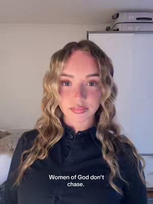 The cover image is a selfie of a woman against a bright background. The woman has long, wavy blonde hair and is wearing a dark shirt. Text overlayed on the image says, 'Women of God don't chase.' The woman has light skin and is looking towards the camera. The lighting appears to be soft and even.