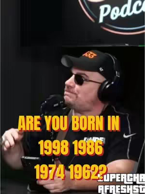 A man wearing sunglasses, a black hat with an orange logo, and headphones is holding a phone with both hands. Above him, text in orange letters asks, "ARE YOU BORN IN 1998, 1986, 1974, 1962?" with a podcast logo in the top right corner.