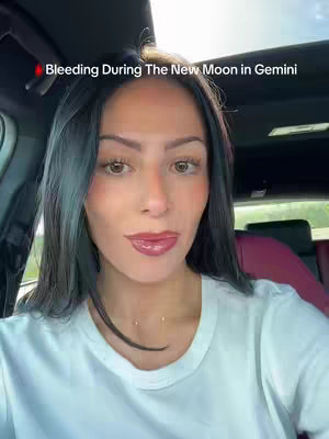 A woman with long dark hair sits in a car, looking directly at the camera. Text overlays the image, with text on the top and the bottom of the cover image.